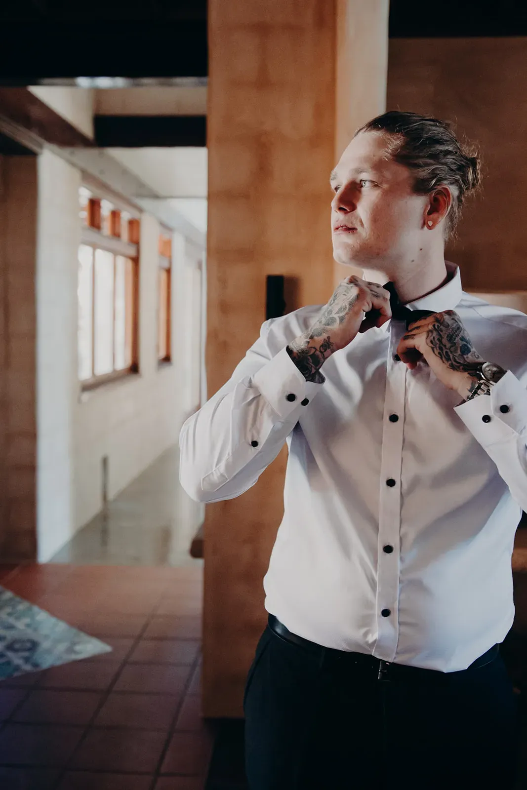 josh_groom_adjusting_bow_tie_4f7bb4c223