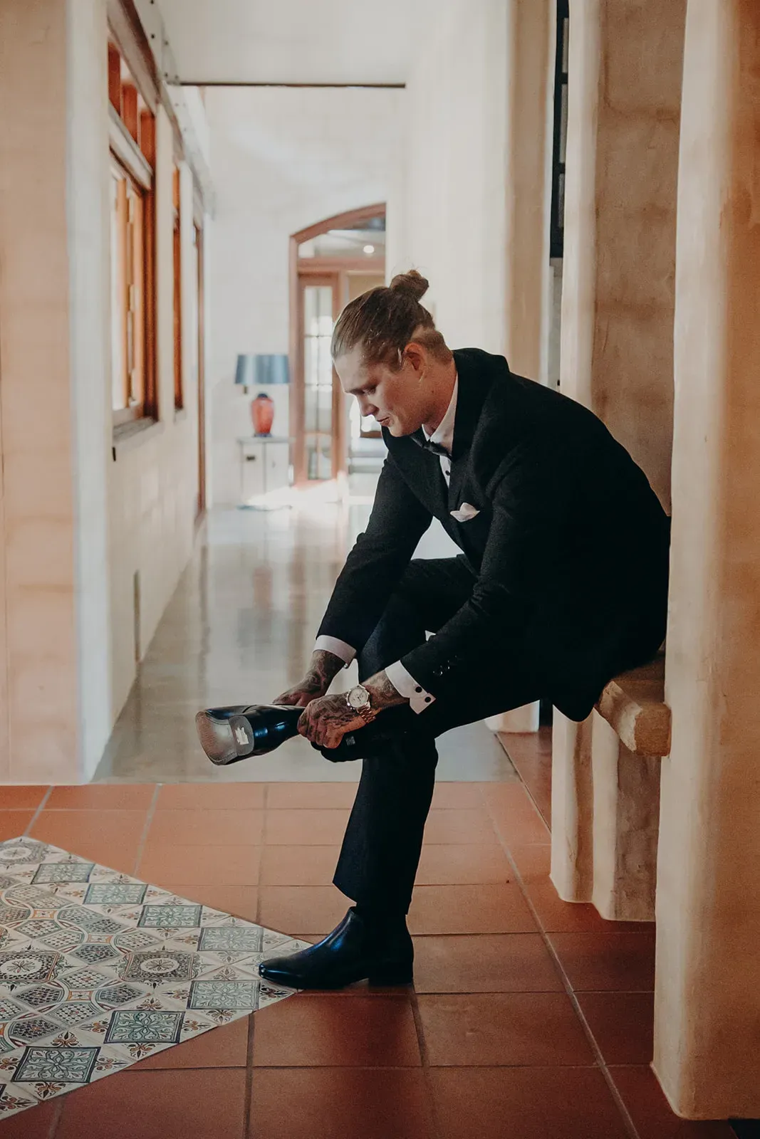 josh_groom_putting_on_shoe_6d59df8928