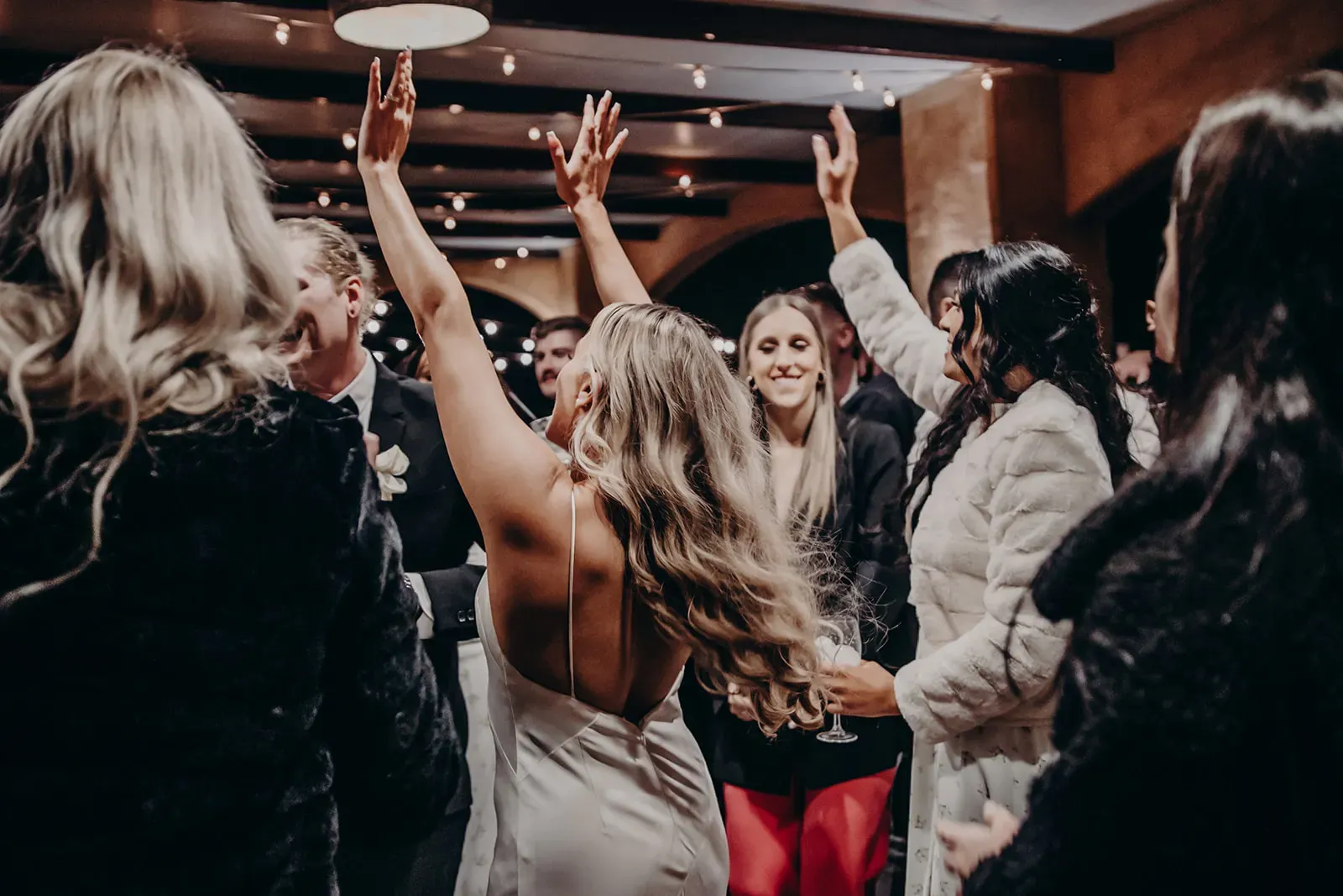 monique_josh_bride_dancing_with_hands_up_4fe395a253