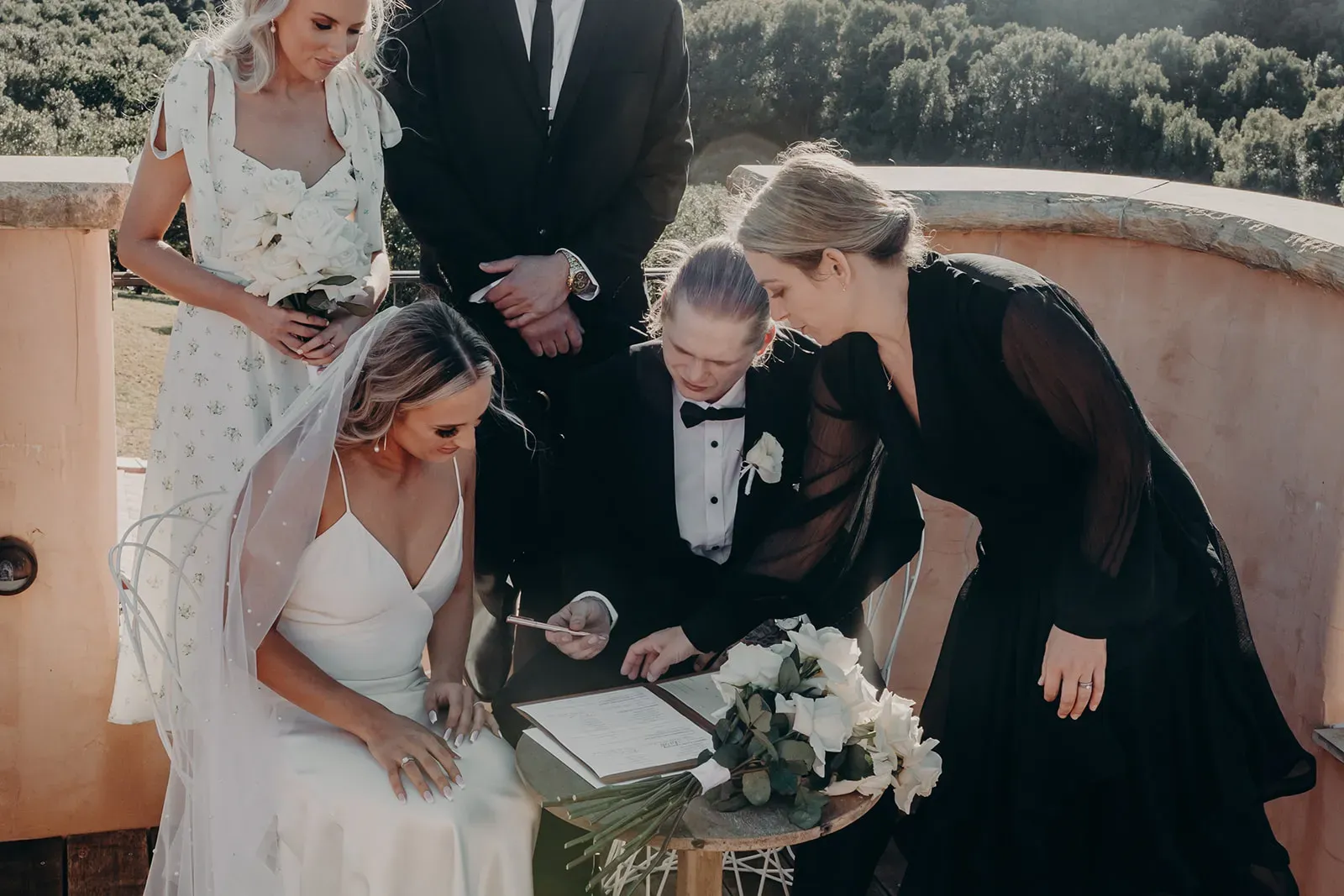 monique_josh_signing_marriage_certificate_ec2764c2c5