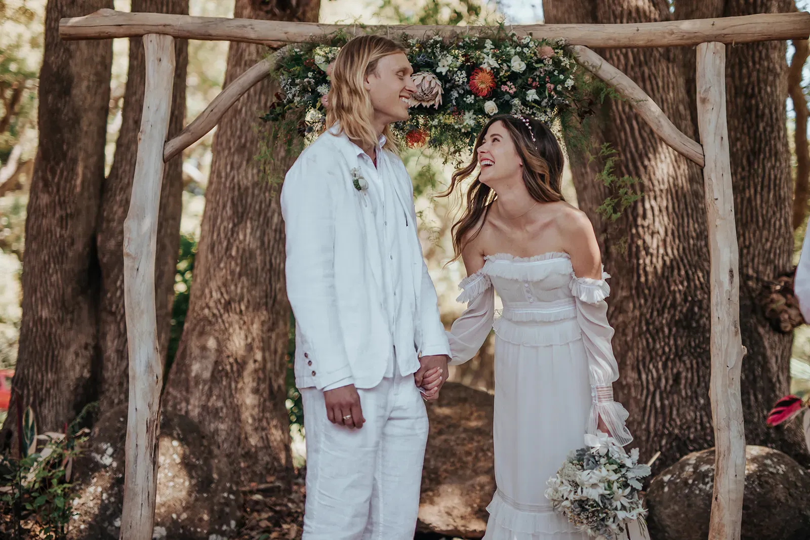 emica_jesse_real_wedding_couple_walking_away_coastal_sunset_wedlii_0af6a8e4ca