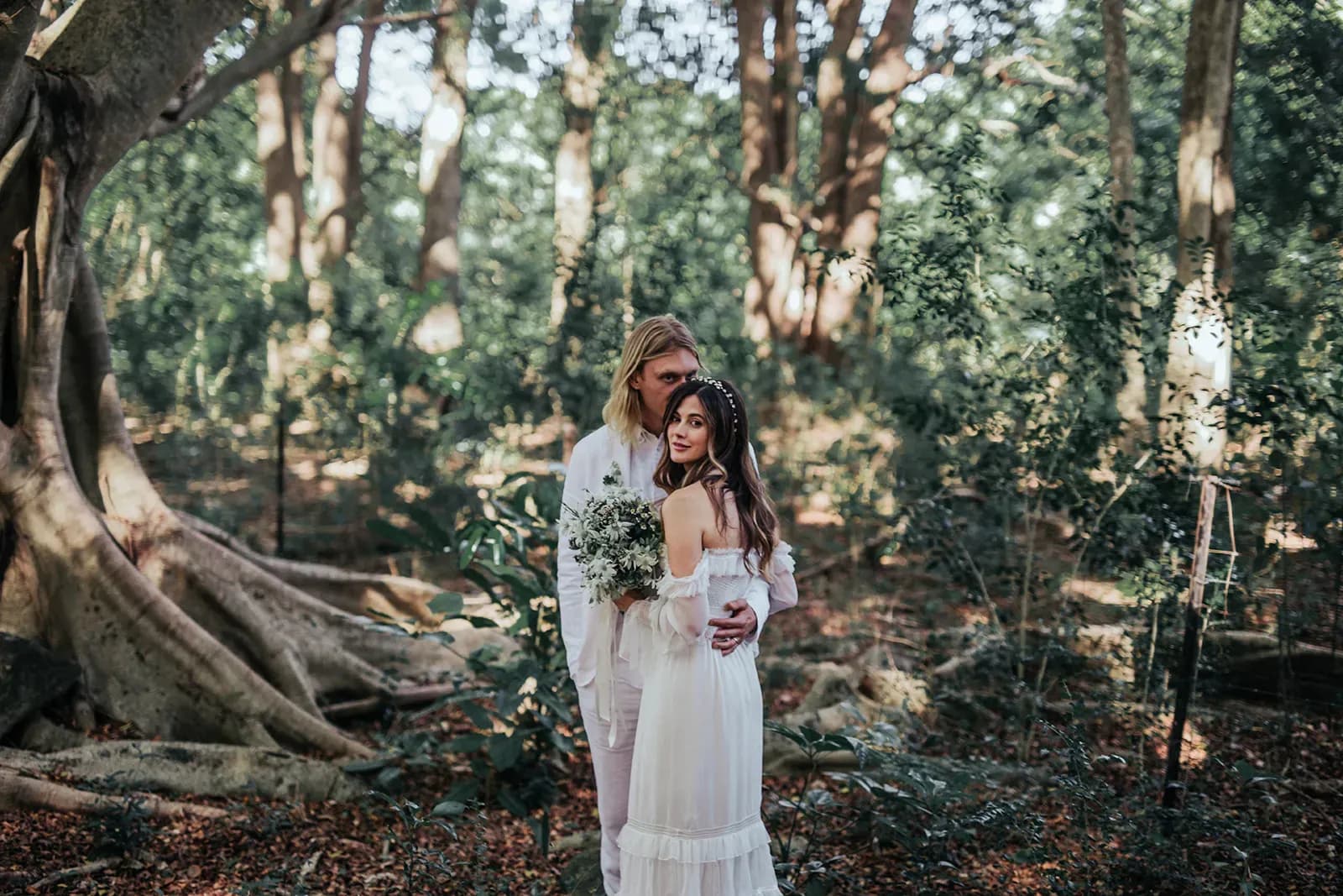 emica_jesse_real_wedding_couple_walking_on_beach_sunset_portrait_wedlii_ebc7395936