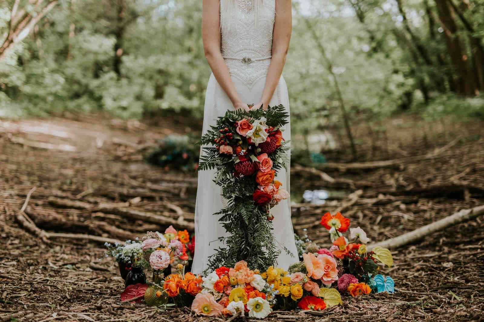 bride_cascading_bouquet_hands_full_shot_forest_f11787816a