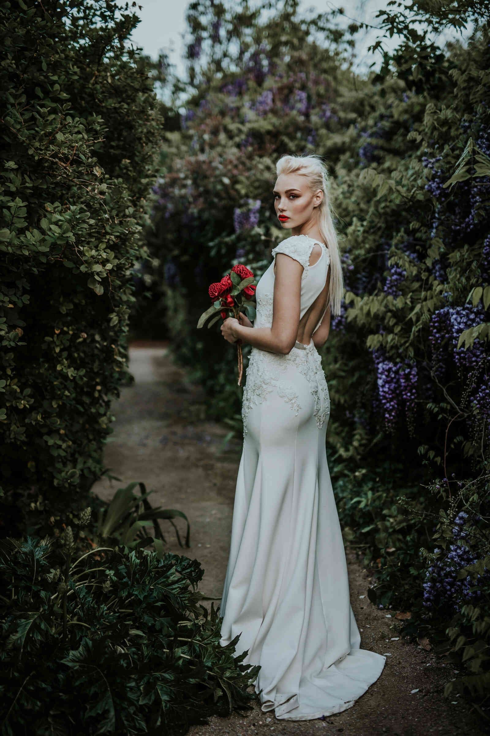 bride_backless_gown_red_bouquet_purple_vines_523687c923