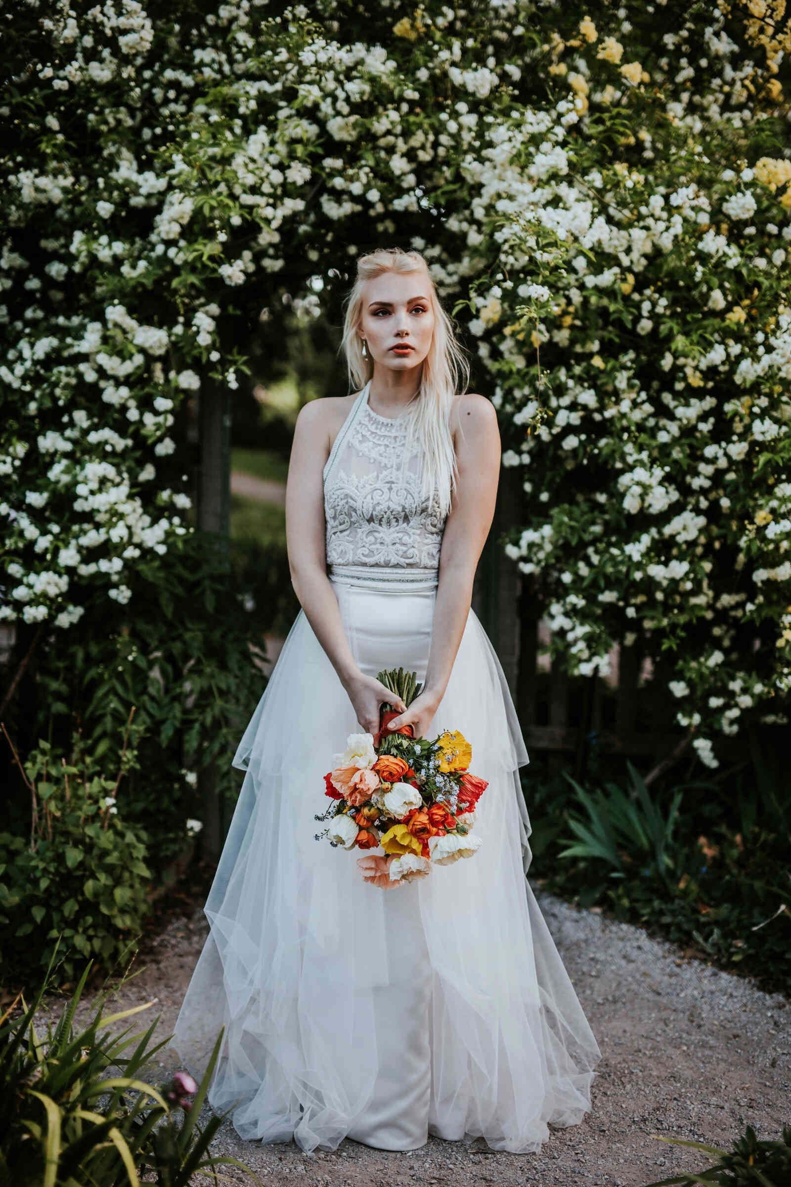 bride_full_portrait_archway_colorful_bouque_d396349c41