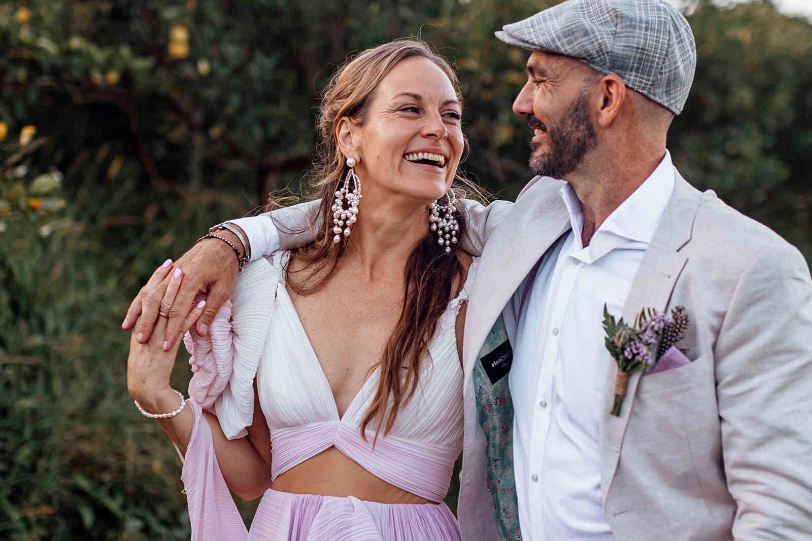 bride_groom_close_up_portrait_tan_suit_pearl_earrings_e0d1ee6ad3