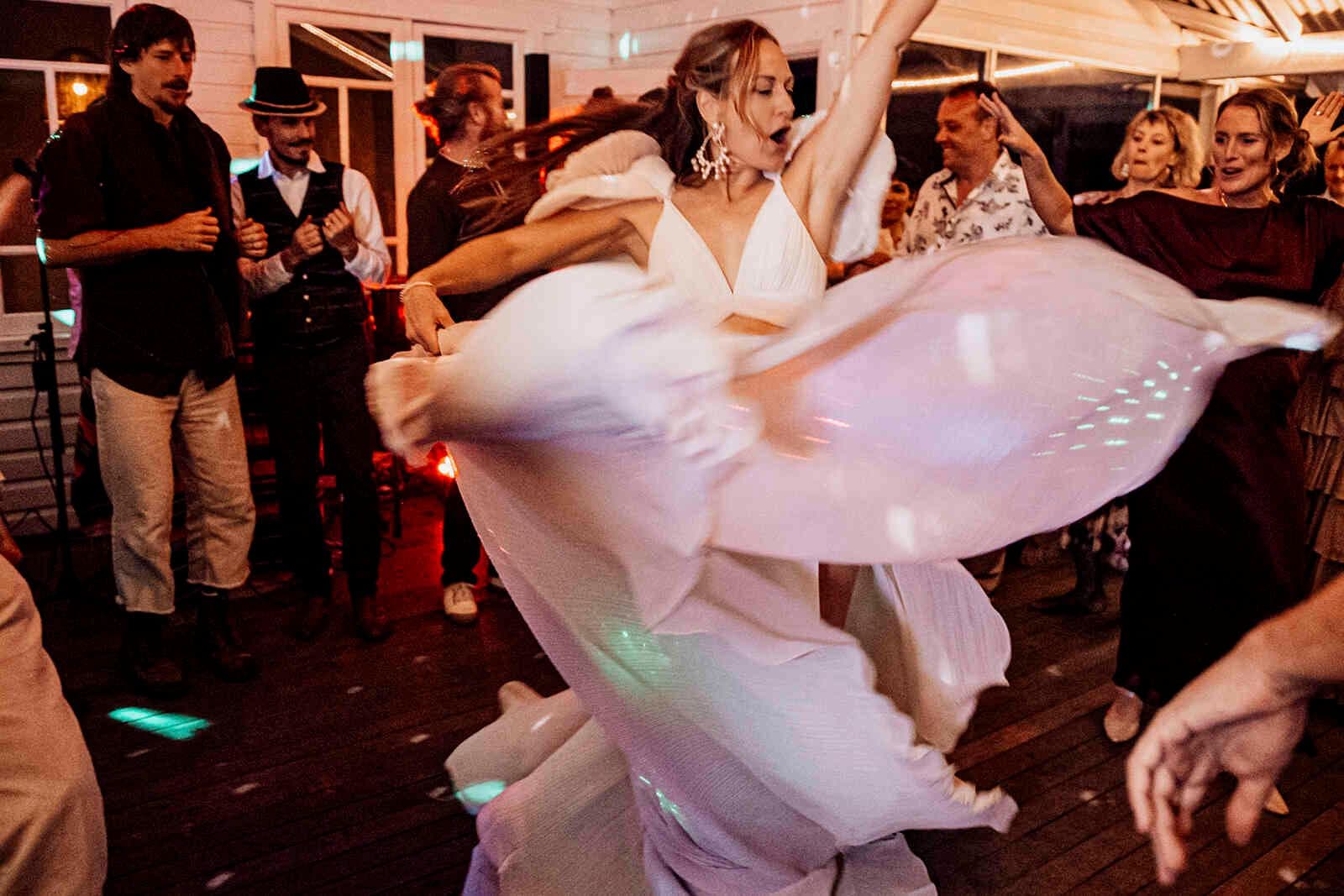 bride_dancing_white_sequin_dress_reception_party_twirl_0eed7244c0