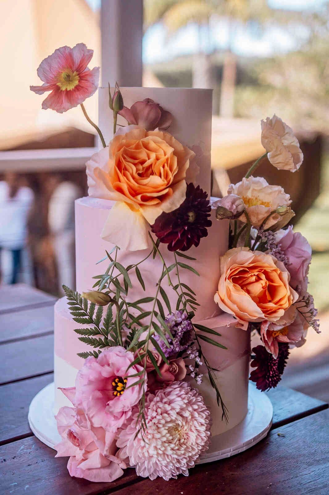 three_tier_wedding_cake_pink_peach_dahlia_floral_decor_46353a5433