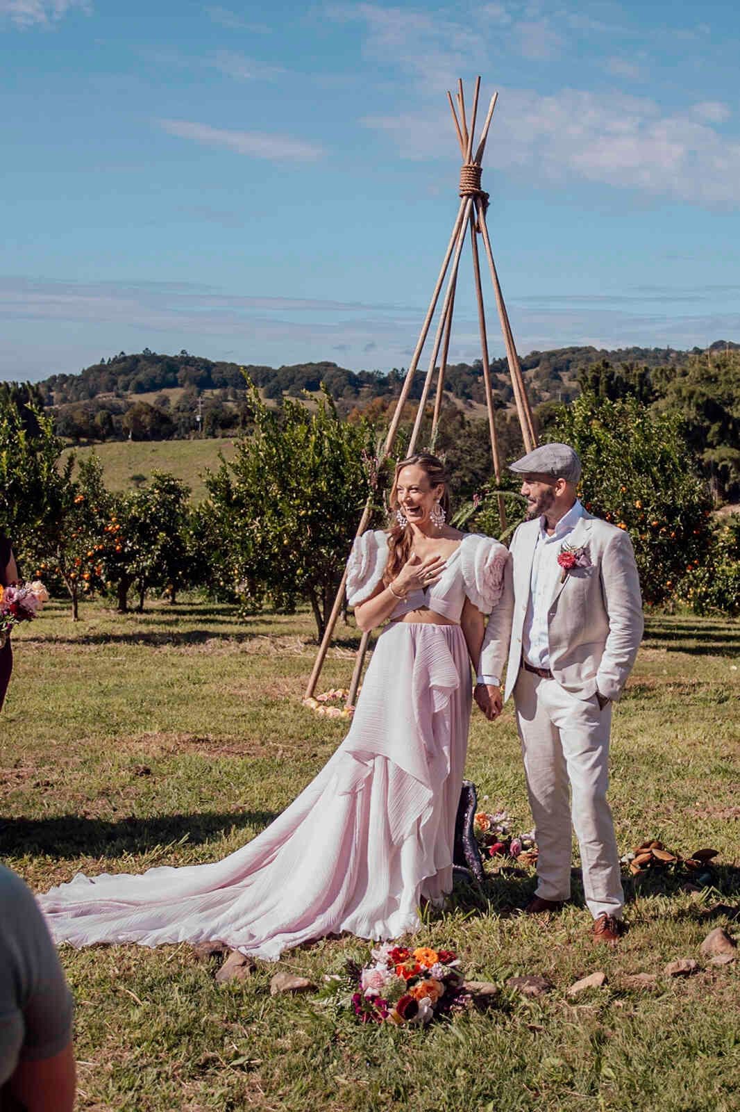 happy_couple_ceremony_pink_two_piece_dress_country_orchard_25768dff45
