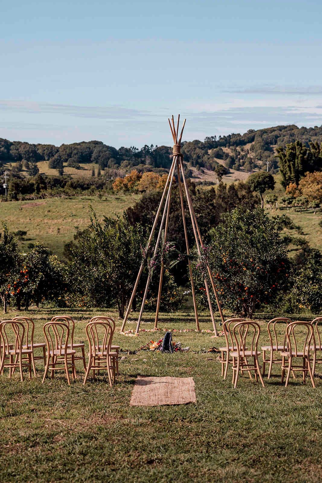 outdoor_wedding_ceremony_arch_teepee_bentwood_chairs_ab0d665007
