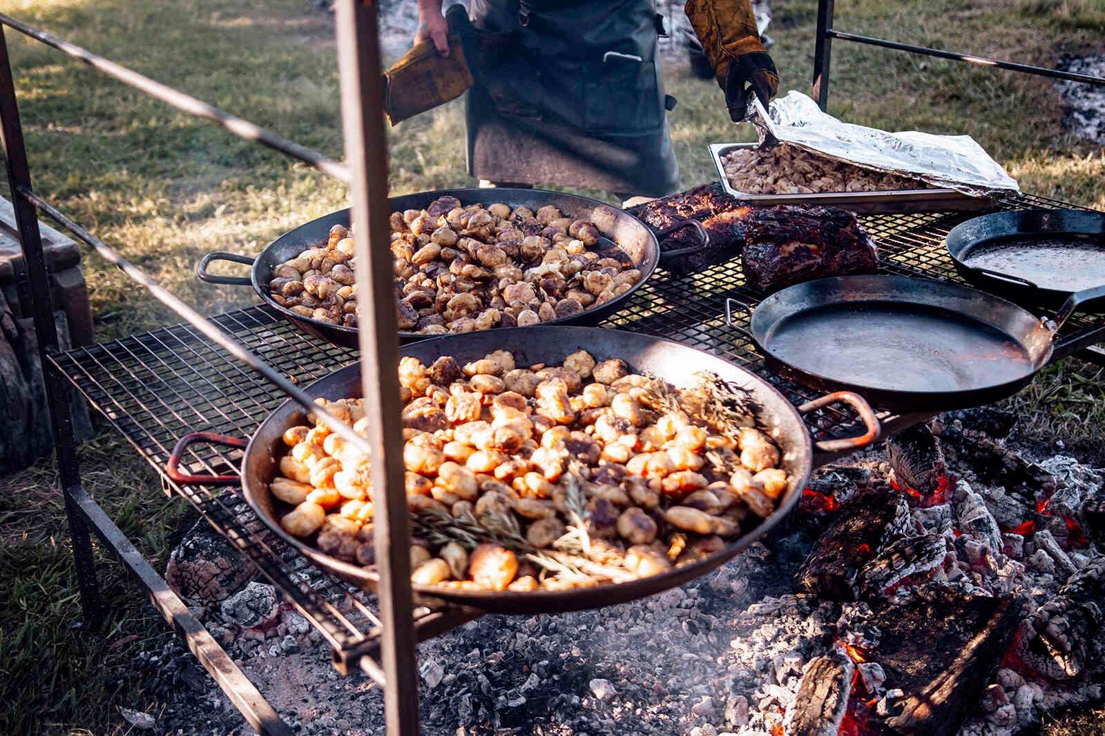 open_fire_catering_spit_roast_potatoes_wedding_food_981eb9dd19