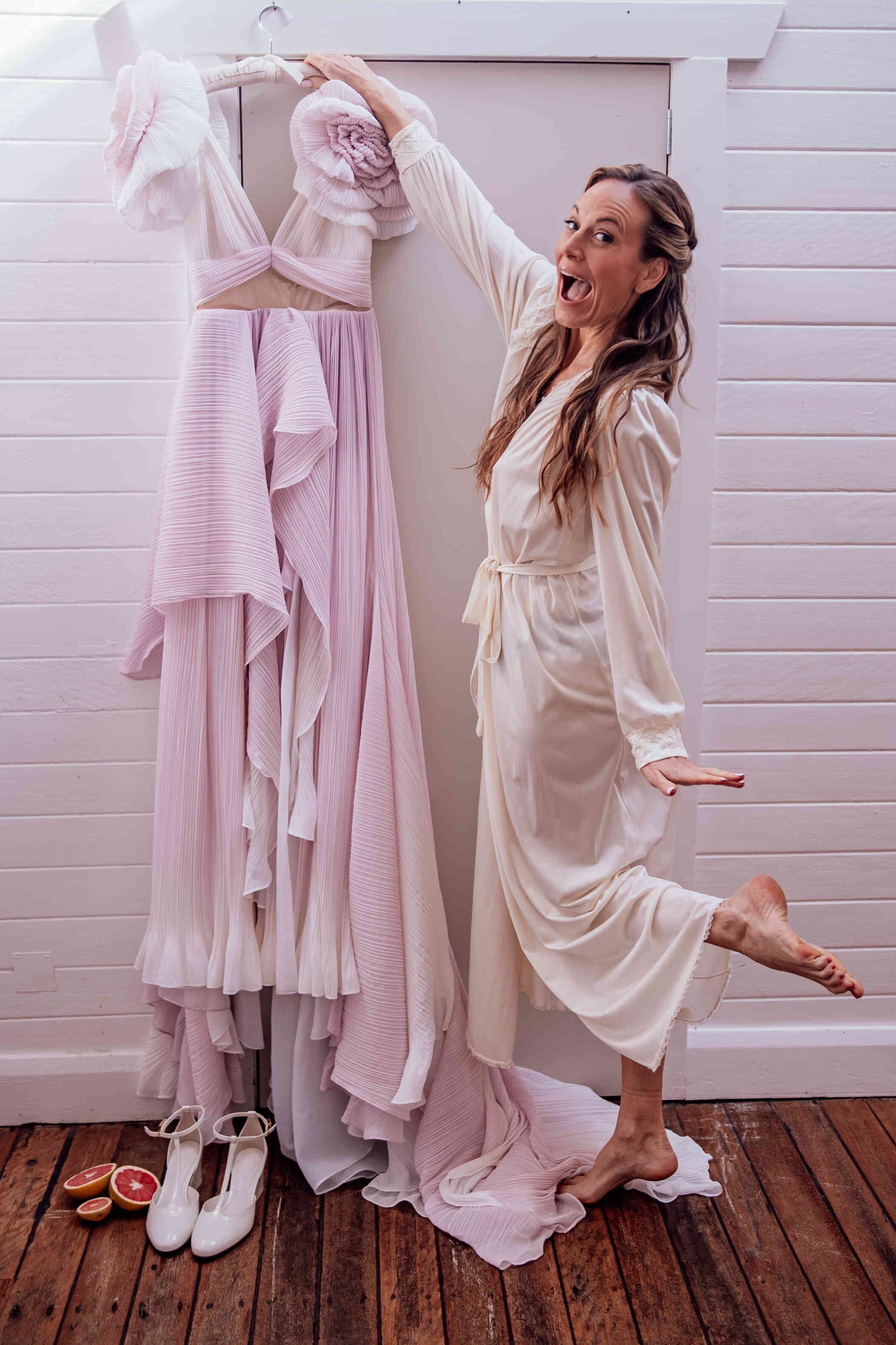 bride_with_long_pink_ruffle_wedding_dress_getting_ready_5ce8feb3f5