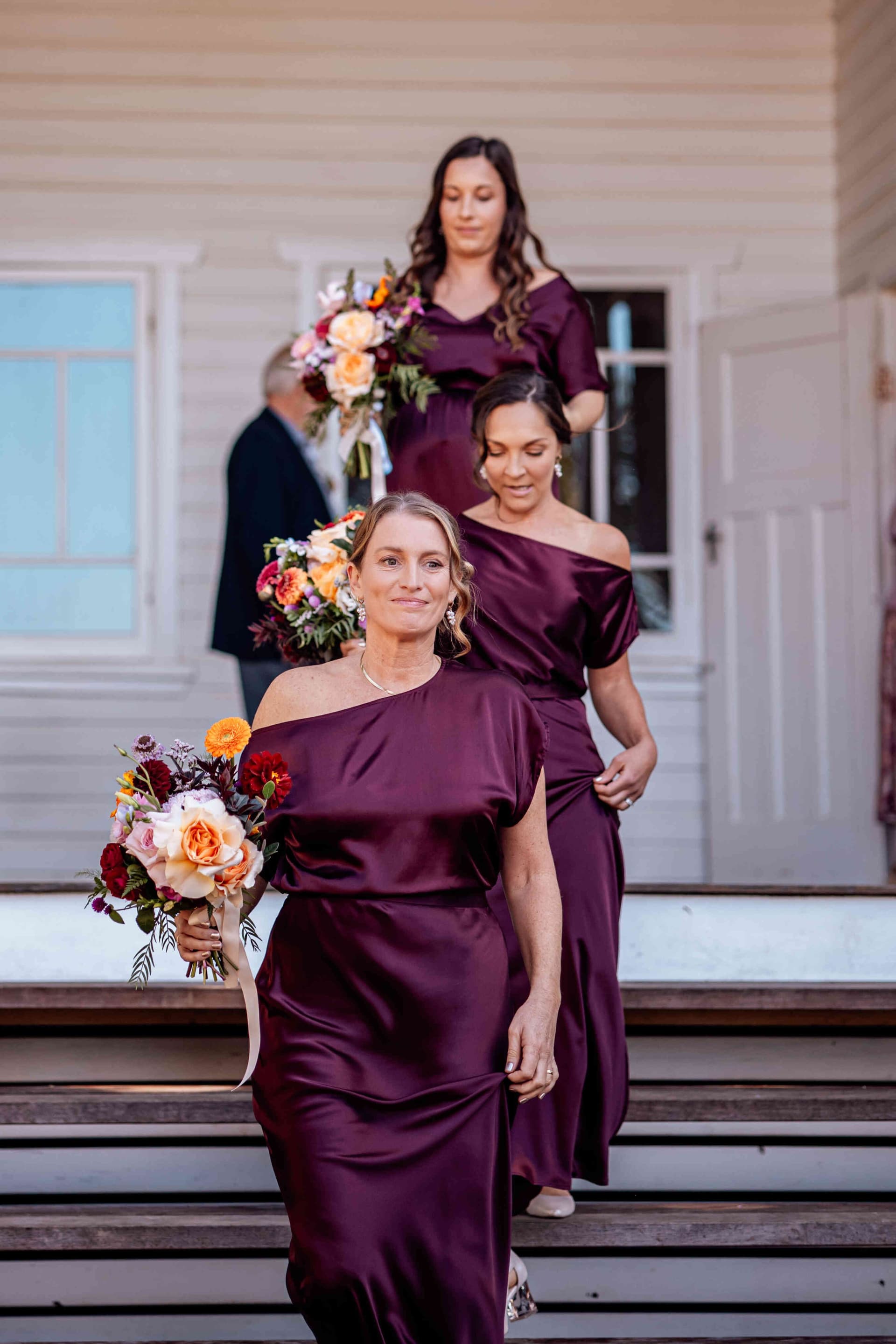 bridesmaids_entrance_burgundy_satin_off_shoulder_dresses_1ed5b119e5