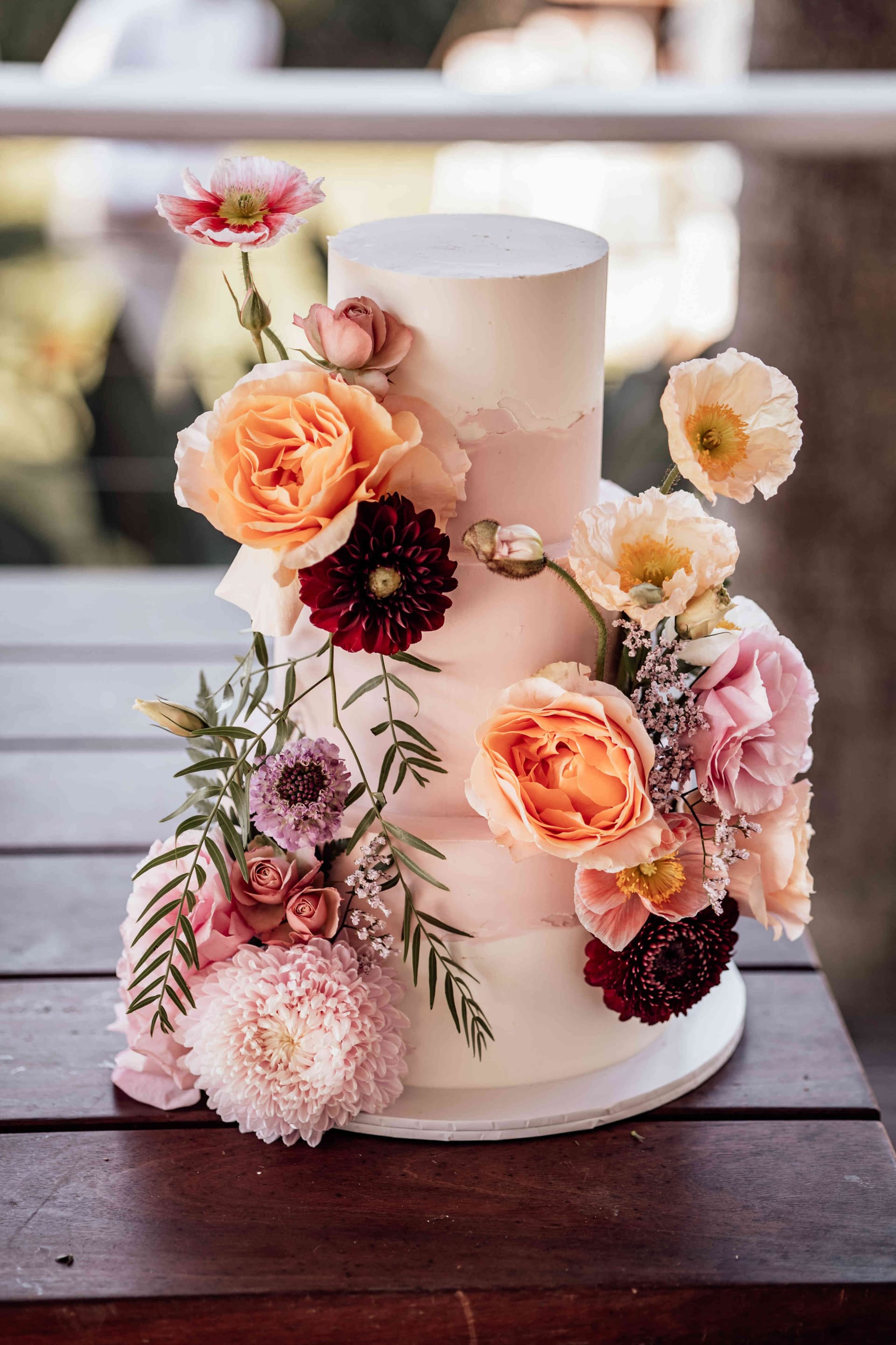 three_tier_wedding_cake_fresh_flowers_pink_peach_be8d1dc49b